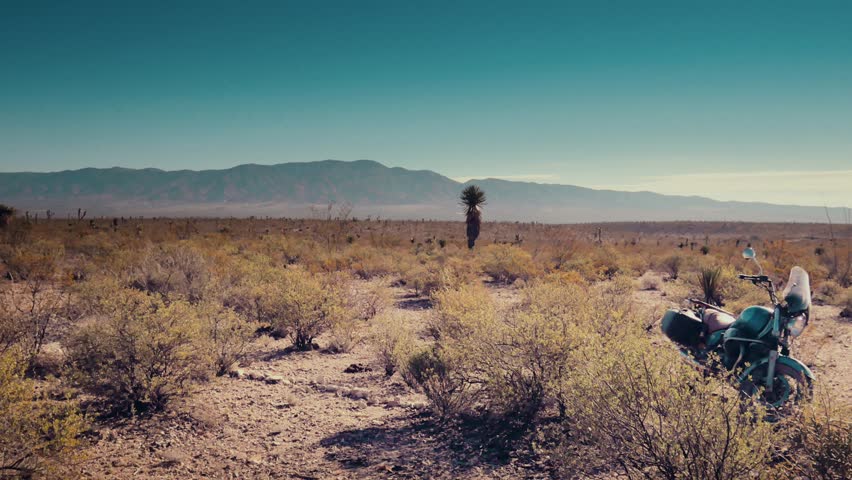 Traveler parked his motorcycle in the mexican desert. 4k  | Shutterstock HD Video #15543910