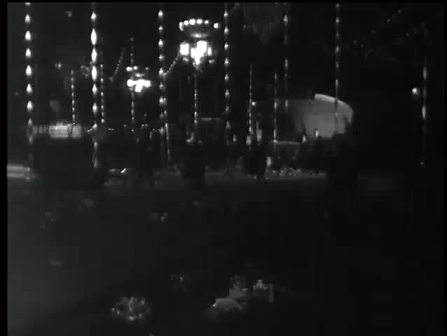 People dressed as zombies running at night, 1960s