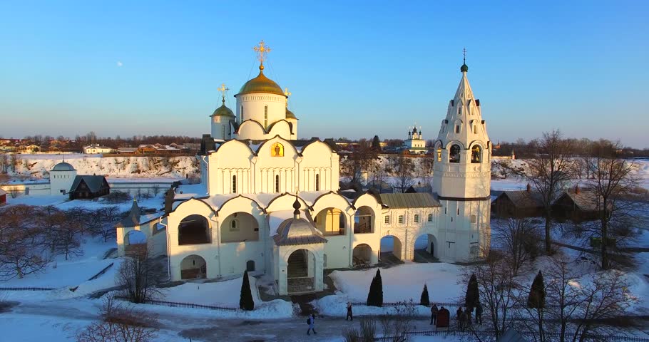 Aerial view of the Pokrovsky Cathedral (1510-1518) and the belfry (17th century) at Pokrovsky female monastery (1364). It stands in a crook of the Kamenka River, in ancient russian town Suzdal. Winter
