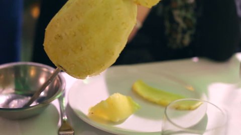 Closeup of pineapple slices with sword in Brazilian Steakhouse Restaurant