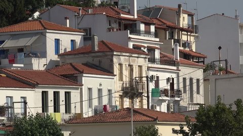 SKIATHOS ISLAND - GREECE, 5 AUGUST, 2015, 4K Residential house and crowded white building in rtaditional city by day