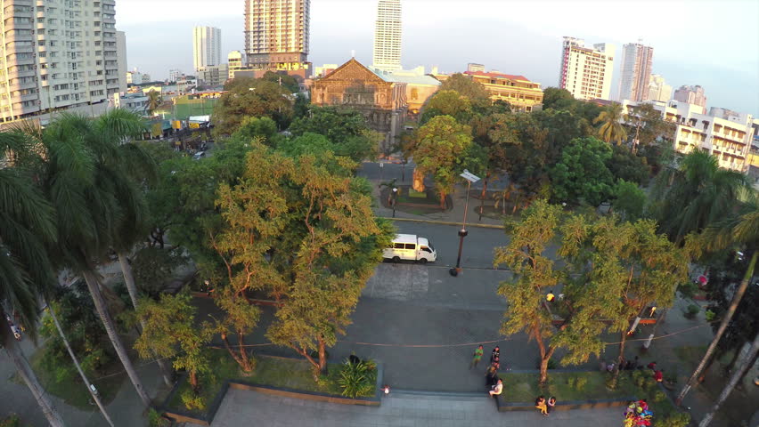 Camera flying above Rajah Sulayman Park in Manila, Philippines