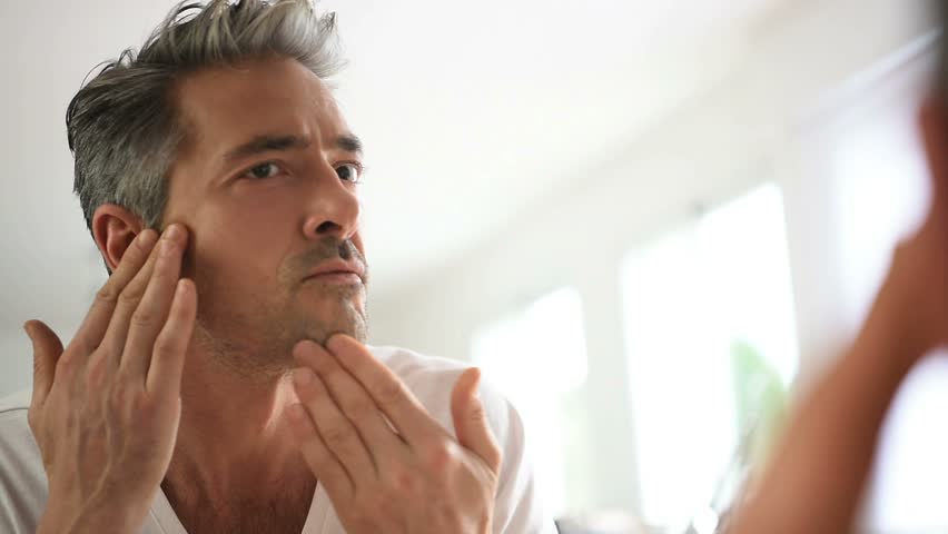 Man taking care of his skin | Shutterstock HD Video #15584716