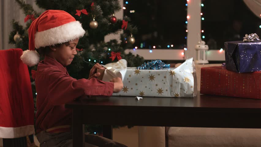 kid opening christmas present