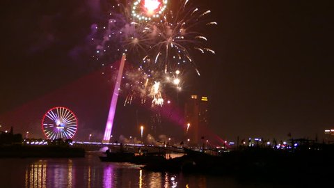 The Tr?n Th? Lý Bridge and Sun Wheel with fireworks celebrating Chinese New Year in Da Nang, Vietnam