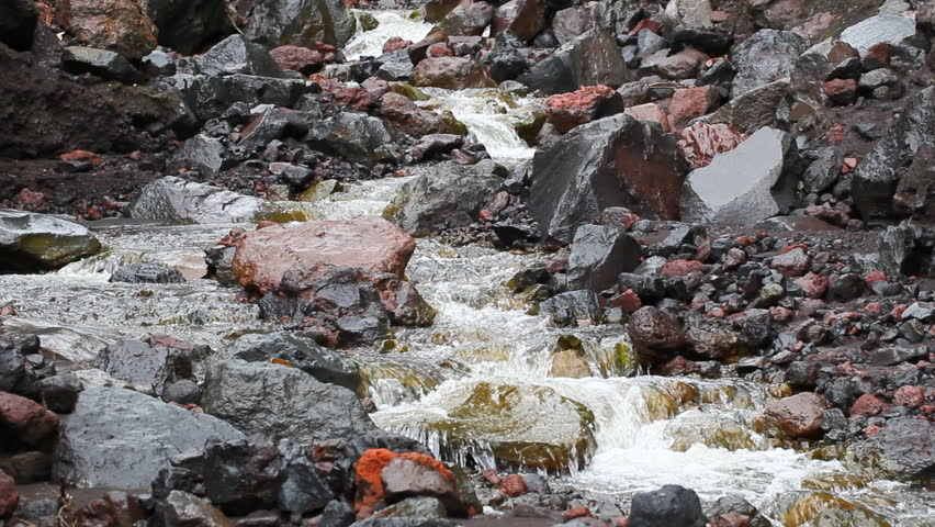 River flowing trough volcanic rocks on Tungurahua mountain, Ecuador