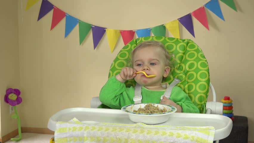 baby eating porridge