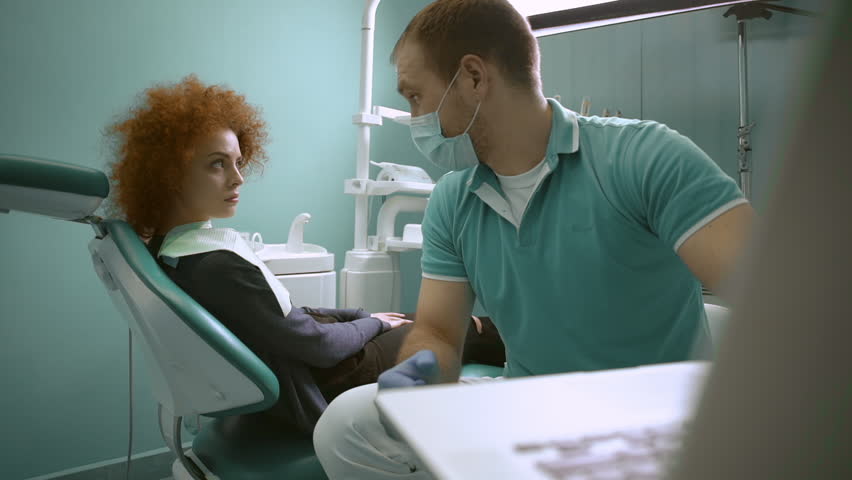 Smiling woman visiting dentist. Slow motion. Close up | Shutterstock HD Video #15608134
