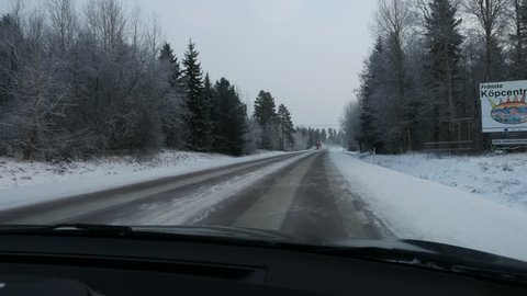 pov Driving car through winter Sweden, steadicam shot Stockvideó