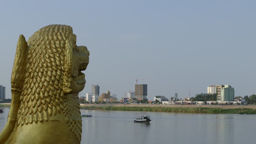 Golden statue at the riverside of Phnom Penh Cambodia