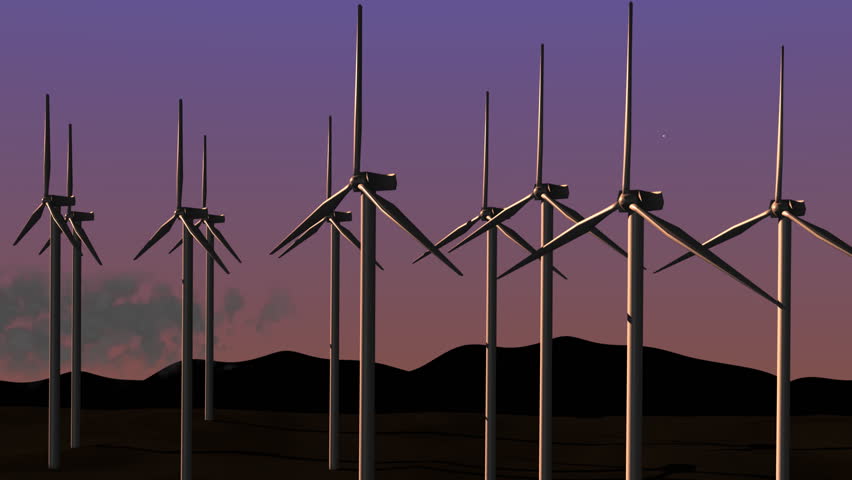 Wind energy turbines spinning at dusk.