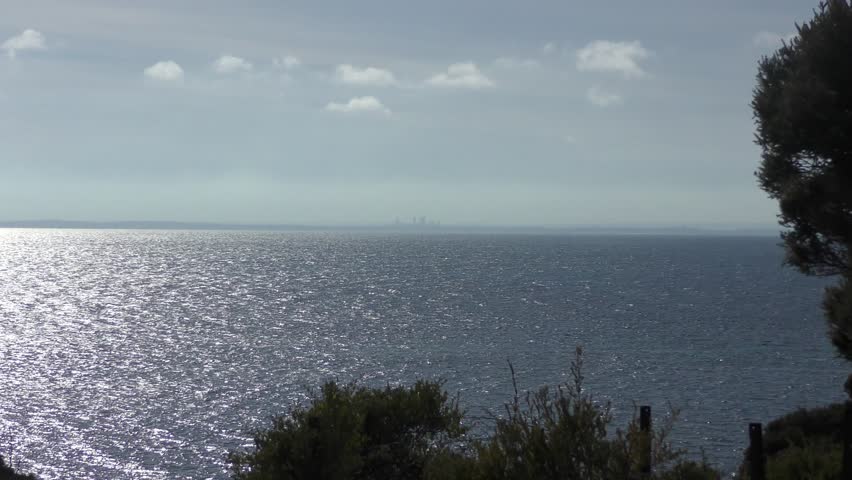 Scenic View of Perth, Western Australia, and the city centres skyscrapers, from Rottnest Island over Indian Ocean and coastline.
