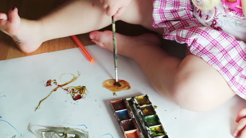 child paints closeup