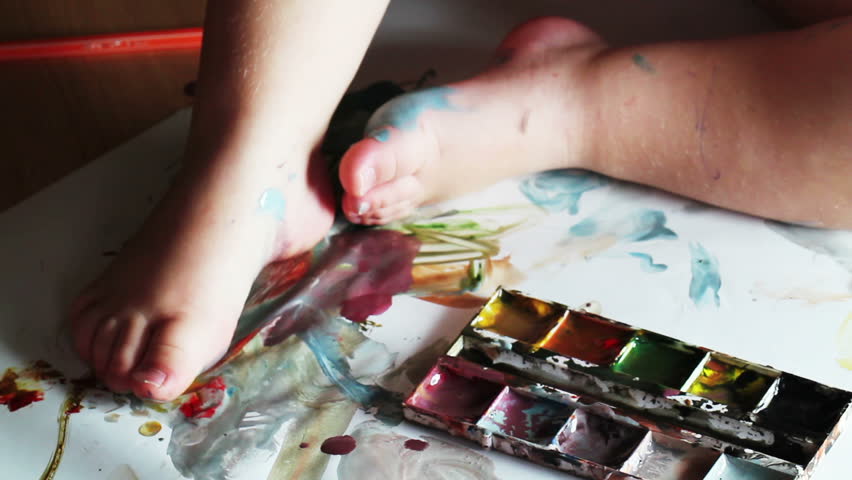 child paints closeup
