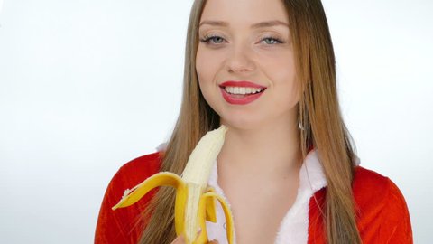 Young girl sexy eating a banana