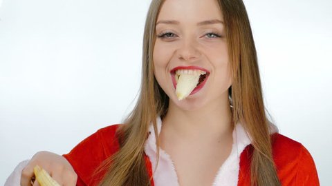 Young girl sexy eating a banana