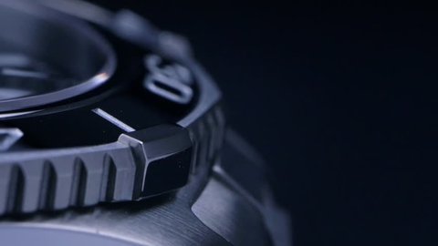 Beautiful abstract shot of a mechanical swiss watch / Slow rotation - macro shot on the steel and ceramic