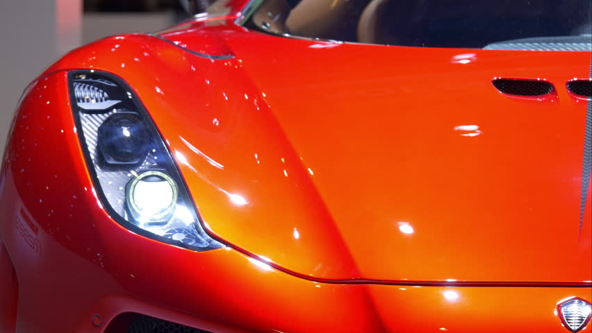 4K italian luxury red car / Dream sport vehicle in a motor show