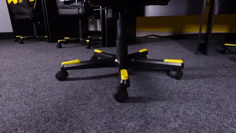 Cross playing computer chair for gamers with rubber footrests.