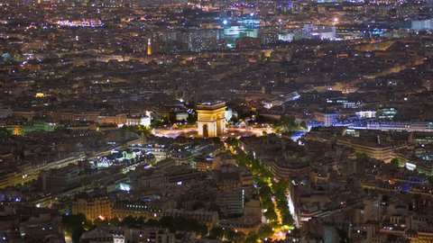 Time lapse of Etoile where the Arc de Triomphe is located seen from Eiffel Tower at night