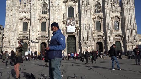 MILAN - ITALY, MARS 4, 2015 , 4K Tourist people enjoy pigeons bird in Duomo Square by day