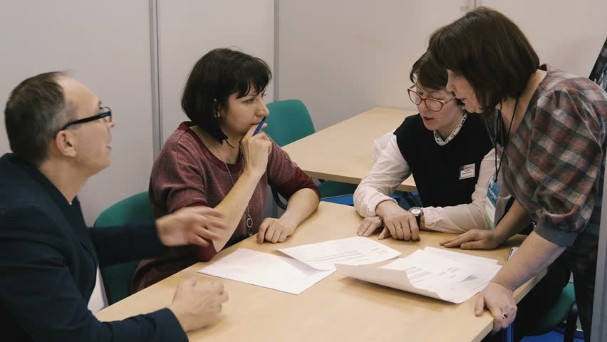 Some people are talking at the table