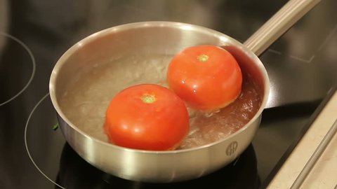 Blanching tomatoes in a stewpan