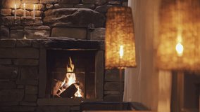 Calm fireplace with warm light at night with candle and one glass of red wine - Powered by Shutterstock - Get 15% off with code: PIKWIZARD15