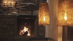 Calm fireplace with warm light at night with candle and wine - Powered by Shutterstock - Get 15% off with code: PIKWIZARD15