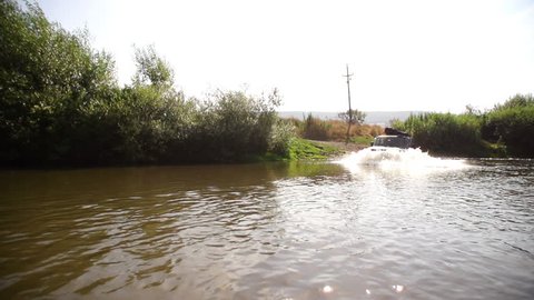 Lada Niva crosses the river