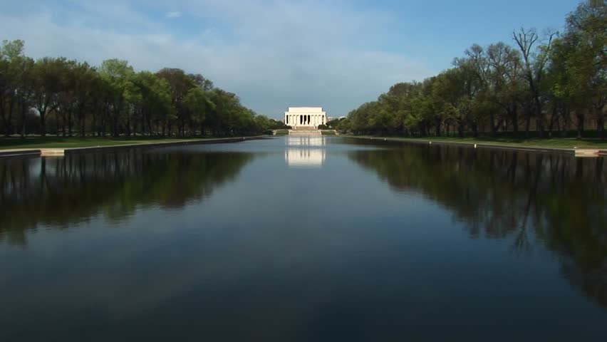 Wide shot of reflecting pool and Lincoln Memorial on the National Mall in Washington, DC