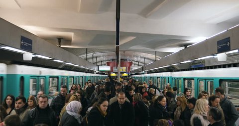 PARIS, FRANCE - FEB 2016: Porte des Versailles Paris metro station with large congestion of people walking to exit the station or to enter the train