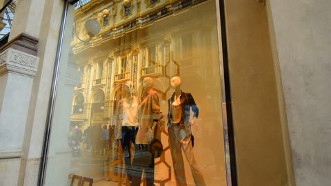 Shop window. Shop in the famous Milan shopping gallery. Mannequins in the transparent shop window. Clothing shop, shop front.