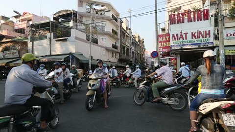 HO CHI MINH CITY (SAIGON), VIETNAM - CIRCA JAN, 2016: Motorcycle traffic in Saigon. Is located in the South of Vietnam, is the country's largest city, population 8 million.