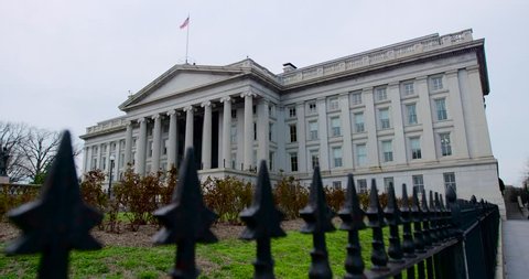 United States Department of the Treasury building with fence. 4K wide shot. Use as a digital zoom. Also available in 4K HDR. This building is on the back of the $10 US Bill.