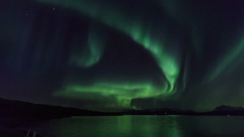 Northern light (aurora borealis) in a fjord 4K
