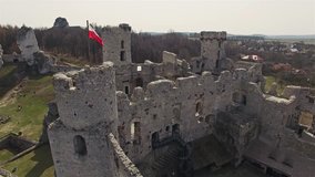Aerial of a Polish flag on top of ruins. 4k video.
