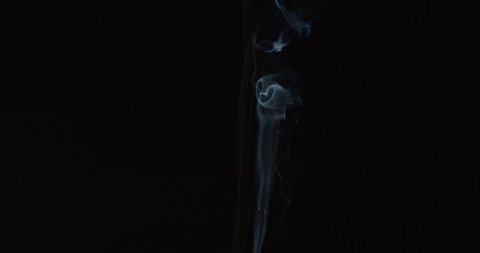 Candle smoke wisps rise in smooth lines and grow turbulent in breeze against black background for compositing, ALPHA MATTE