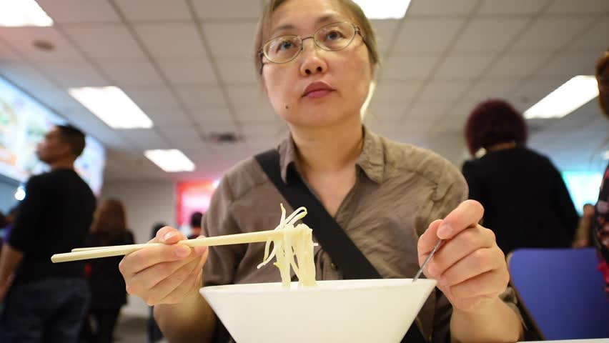 Woman eat rice noodle in restaurant Royalty-Free Stock Footage #15678256