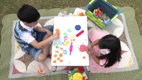 asian kids playing together outdoor | 4k video with zoom in technique