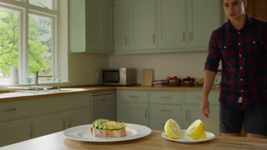 Man preparing a healthy lunch while at home. Hampstead, :ondon, UK August, 2015