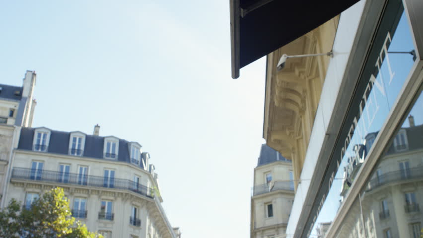 Young Lady working on her tablet while at a local cafe. Paris, France