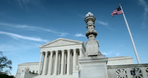 The US Supreme Court medium wide with flag and light pole. Also available in 4K SLog.