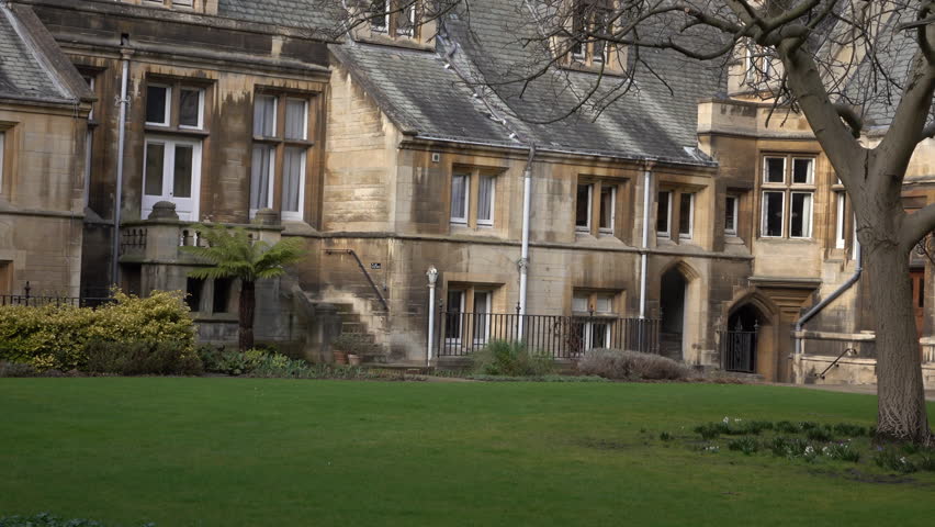 CAMBRIDGE, ENGLAND - MAR 2016: Cambridge University England courtyard garden. North of London. University of Cambridge, founded in 1209 and one of the top five universities in the world.