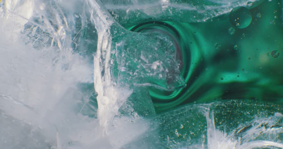 Ice cubes floating in liquid. 