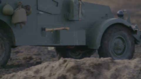 Old military truck goes through the countryside