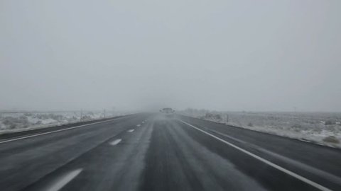 US snowing I 15 interstate snowed road in Nevada USA