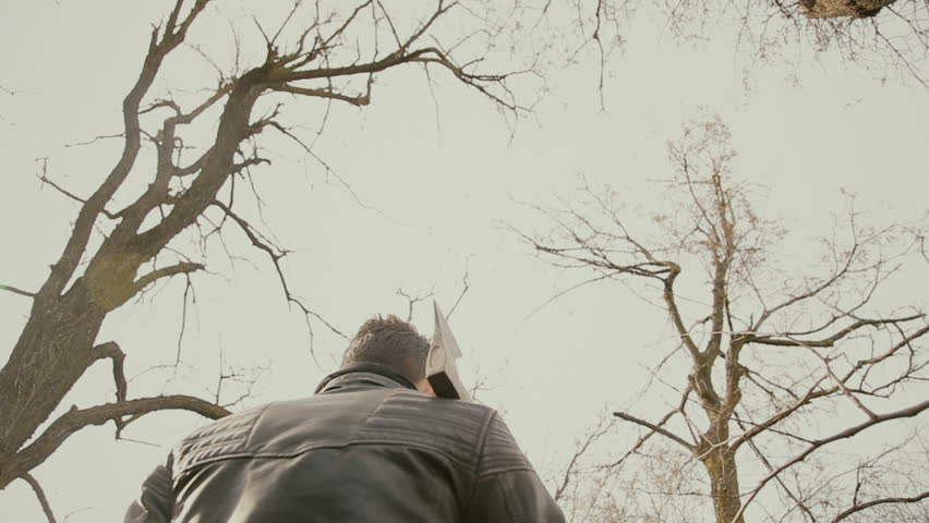 A man in a leather with an axe 