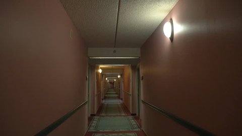 A POV shot walking down a hotel corridor