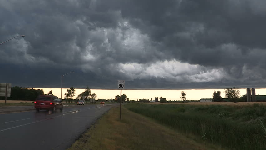 Waterloo, Ontario, Canada July 2014 Dark swirling thunderstorm clouds moving in over city
